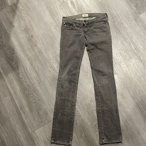 Frankie B woman’s jeans. Super low rise boot cut in washed steel grey .